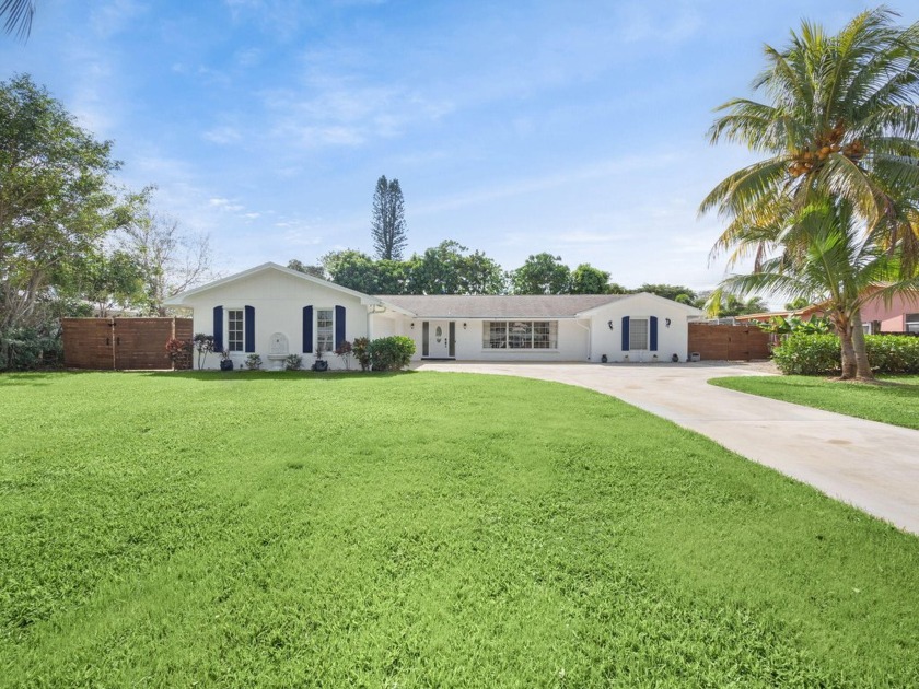 THIS SPACIOUS 4 BEDROOM/2 BATH HOME WITH A LARGE SCREENED IN - Beach Home for sale in Tequesta, Florida on Beachhouse.com
