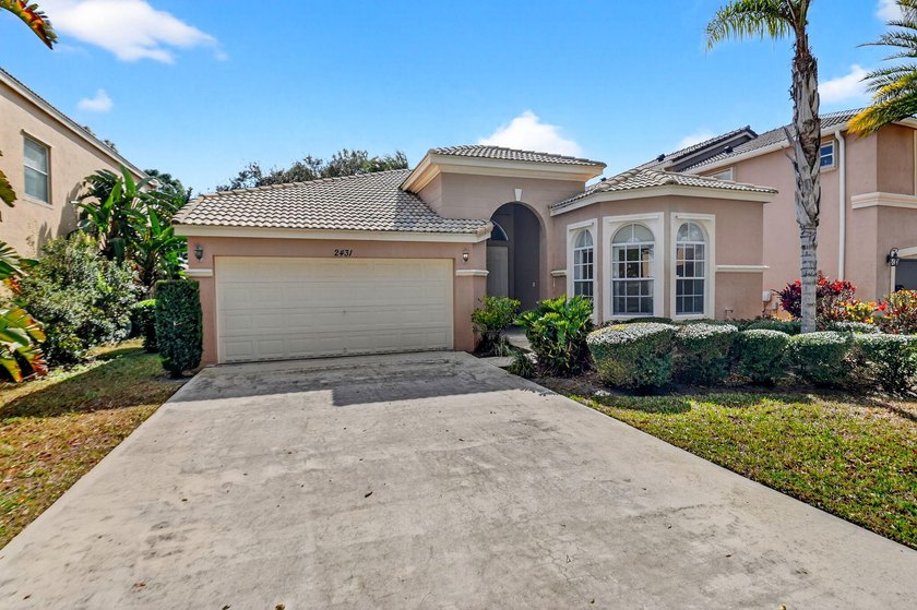 Welcome home to Madison Green! This 3-bedroom, 2-bath home is - Beach Home for sale in Royal Palm Beach, Florida on Beachhouse.com