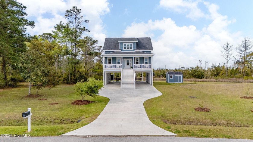 Just off the main living area, you'll find a convenient laundry - Beach Home for sale in Beaufort, North Carolina on Beachhouse.com