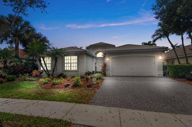This stately Madrid Model POOL home with with Lake Views has it - Beach Home for sale in Boynton Beach, Florida on Beachhouse.com