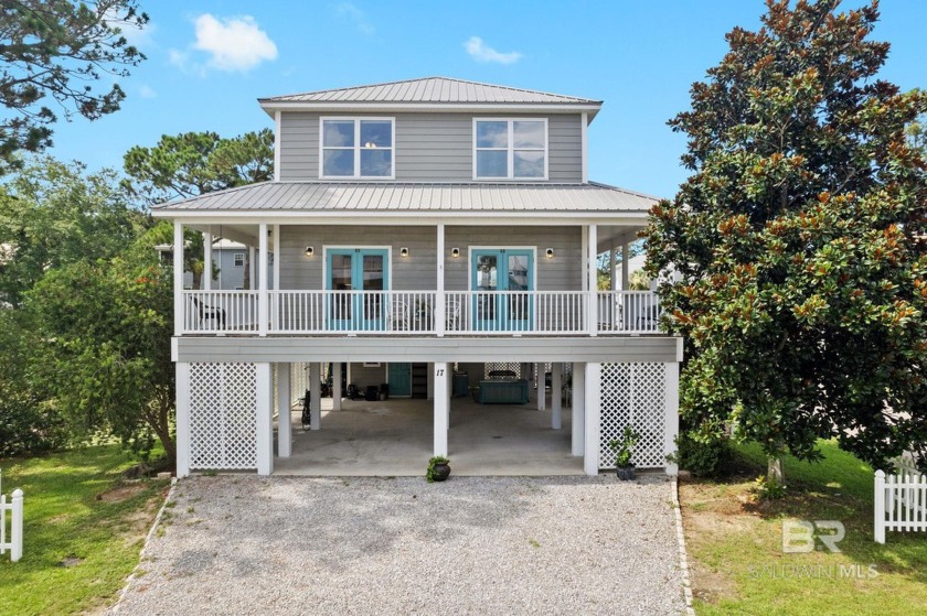 Enjoy the bay life! This charming raised beach cottage overlooks - Beach Home for sale in Gulf Shores, Alabama on Beachhouse.com