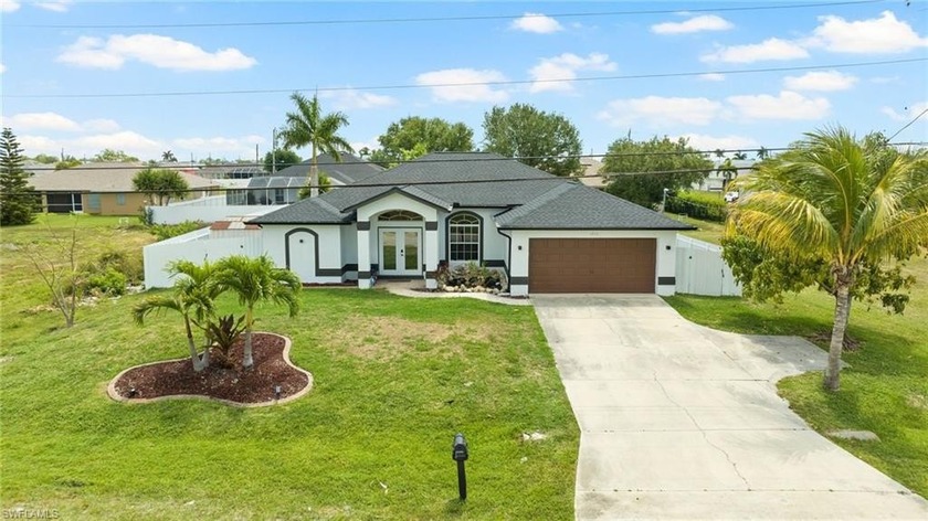 Discover this spacious 4-bedroom, 2-bathroom pool home in Cape - Beach Home for sale in Cape Coral, Florida on Beachhouse.com