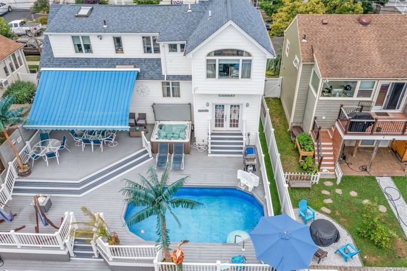 Experience luxury waterfront living in the charming Incorporated - Beach Home for sale in Lindenhurst, New York on Beachhouse.com