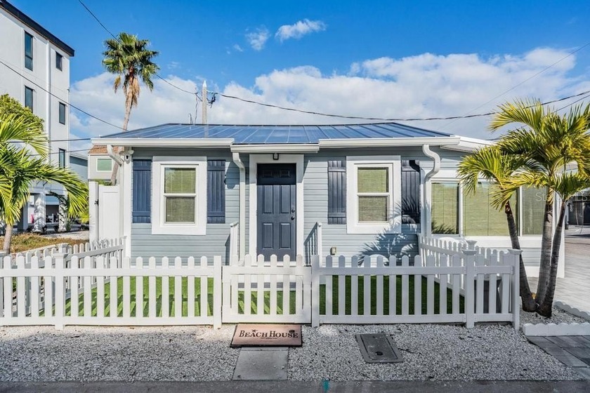 Welcome to this beautifully reimagined, fully renovated and - Beach Home for sale in Treasure Island, Florida on Beachhouse.com