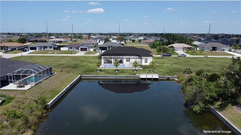 Welcome to this brand-new construction home in Cape Coral, where - Beach Home for sale in Cape Coral, Florida on Beachhouse.com