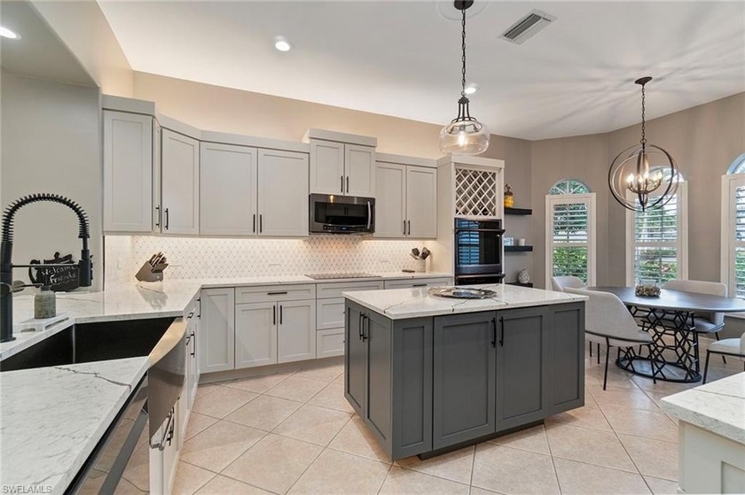 Poised on a secluded preserve-facing lot, this impressively - Beach Home for sale in Fort Myers, Florida on Beachhouse.com