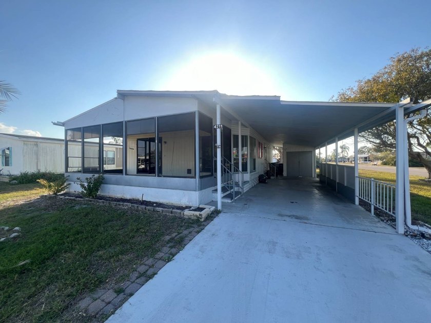This charming 2-bedroom, 2-bathroom manufactured home is nestled - Beach Home for sale in Ellenton, Florida on Beachhouse.com