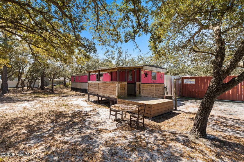 Tucked around oak trees, this coastal hideaway is packed with - Beach Home for sale in Supply, North Carolina on Beachhouse.com