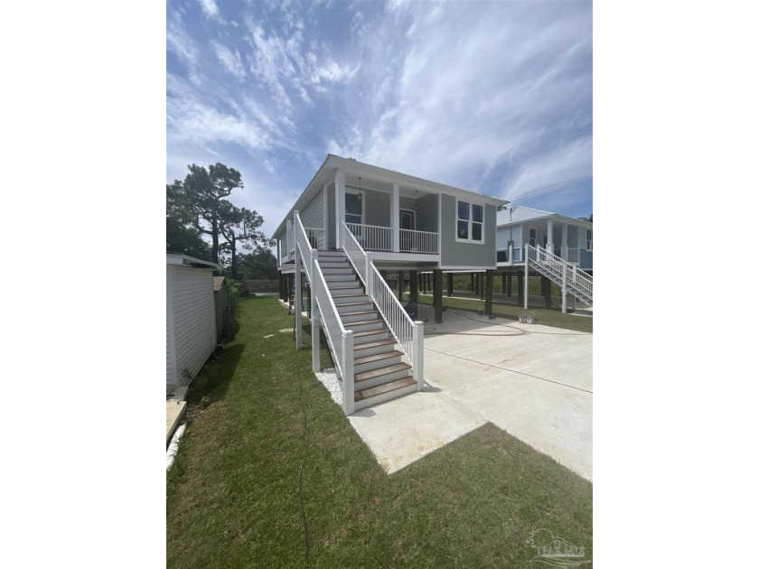 Experience the charm of waterfront living in this beautifully - Beach Home for sale in Milton, Florida on Beachhouse.com