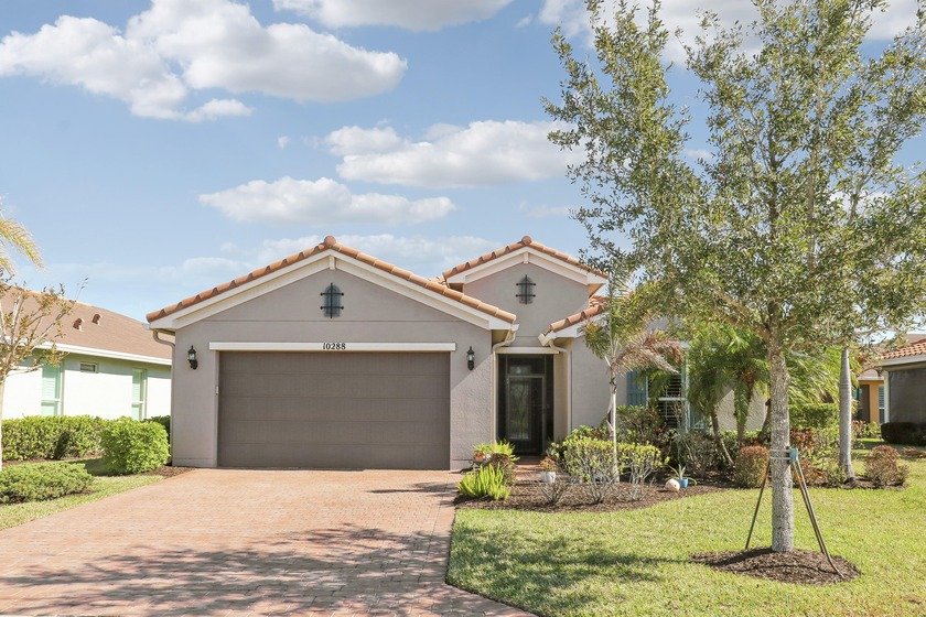 Wake up to gorgeous lake views in this 2BR+Den/2BA/2CG Jensen - Beach Home for sale in Port Saint Lucie, Florida on Beachhouse.com