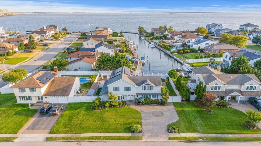 Welcome to this spacious and versatile 6-bedroom waterfront home - Beach Home for sale in West Islip, New York on Beachhouse.com