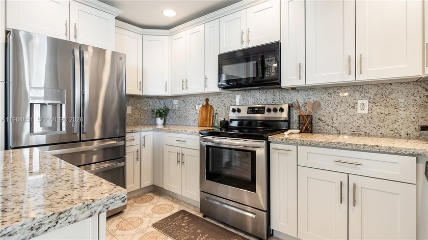 THIS IS IT! Experience elevated living in this gorgeous - Beach Home for sale in Sunrise, Florida on Beachhouse.com