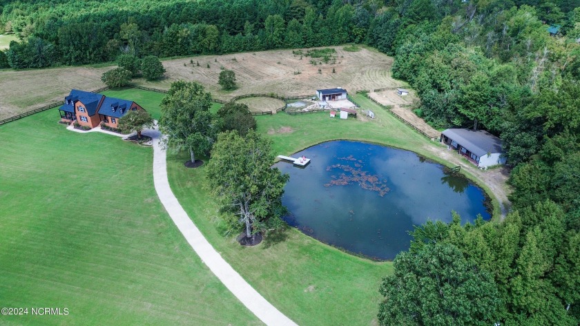 Animal enthusiast paradise! This sprawling 11.22 acre property - Beach Home for sale in Moyock, North Carolina on Beachhouse.com