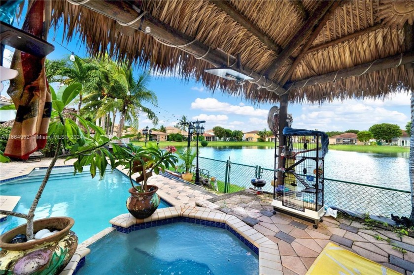 Beautiful 5-bed, 3.5-bath pool home with stunning lake views in - Beach Home for sale in Homestead, Florida on Beachhouse.com