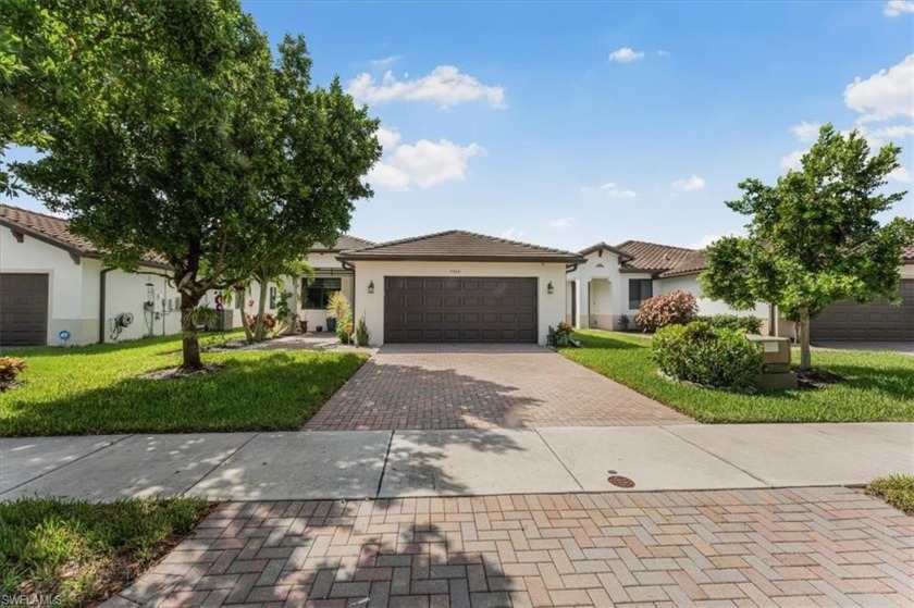 Be welcomed into this beautifully maintained home in Ave Maria - Beach Home for sale in Ave Maria, Florida on Beachhouse.com