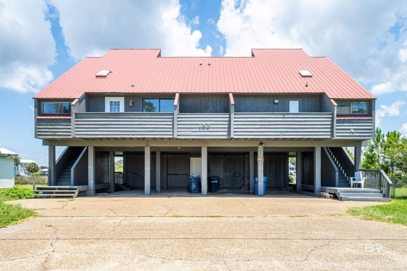 Discover peaceful coastal living in this beautifully updated 2 - Beach Home for sale in Gulf Shores, Alabama on Beachhouse.com