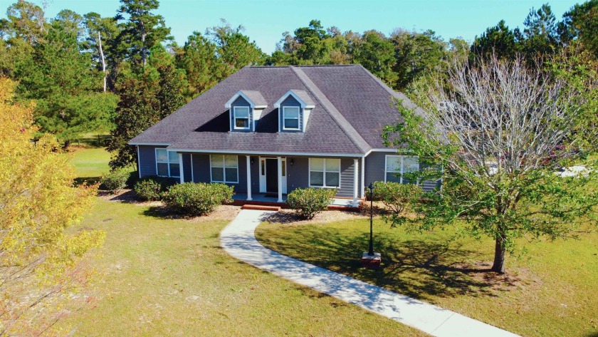 Step into the embrace of luxury with this enchanting 5-bedroom - Beach Home for sale in Crawfordville, Florida on Beachhouse.com