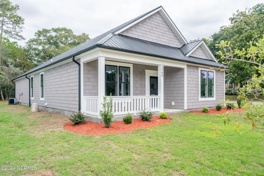 This amazing new construction home has over 1700 sqft of - Beach Home for sale in Oak Island, North Carolina on Beachhouse.com