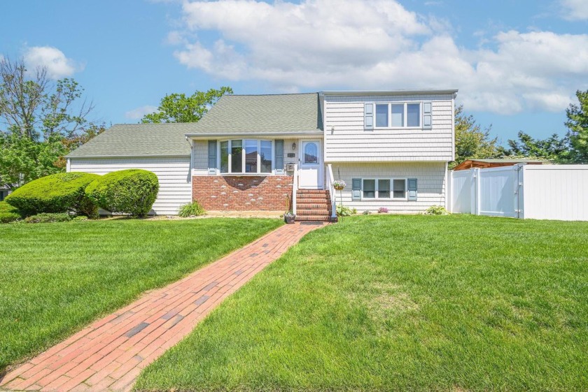 Set on an oversized 9,000 sq ft lot in the coveted Biltmore - Beach Home for sale in Massapequa, New York on Beachhouse.com