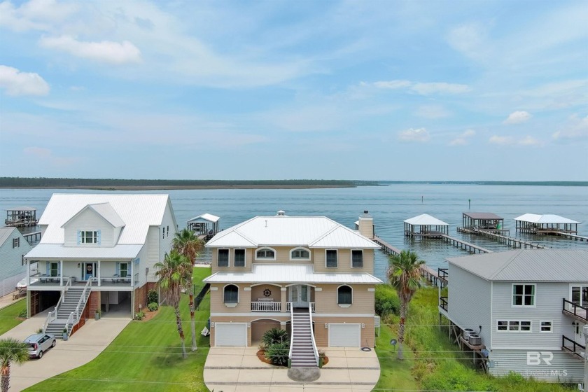 This is a must see, a beautiful waterfront property on Wolf Bay - Beach Home for sale in Orange Beach, Alabama on Beachhouse.com