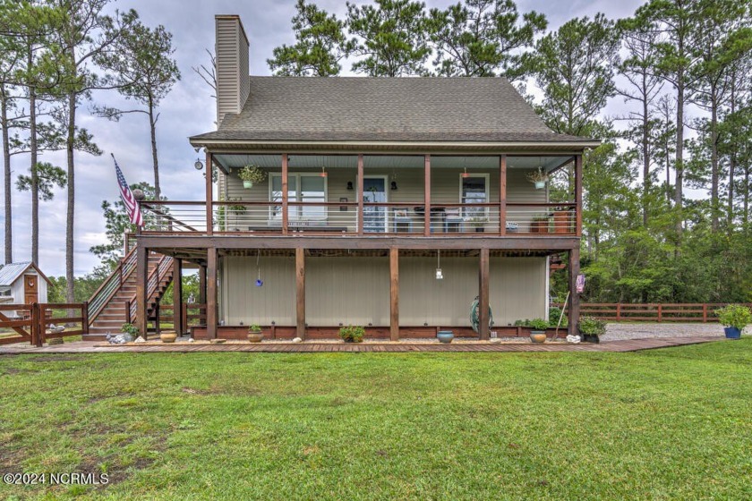 This charming waterfront retreat on Spring Creek sits on over 4 - Beach Home for sale in Aurora, North Carolina on Beachhouse.com