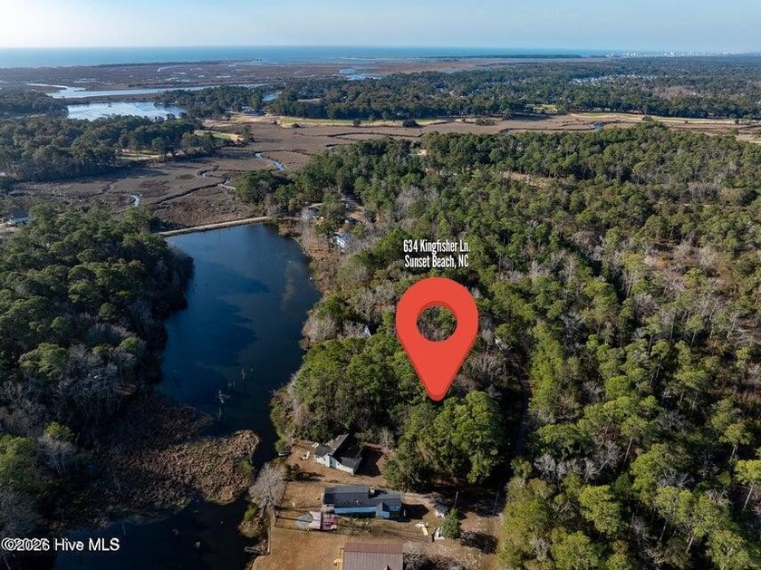 Just under an acre of waterfront property in the Sunset Lakes - Beach Lot for sale in Sunset Beach, North Carolina on Beachhouse.com
