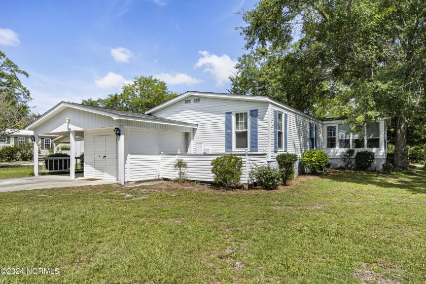 This home is nestled on a picturesque homesite on a quaint - Beach Home for sale in Hampstead, North Carolina on Beachhouse.com