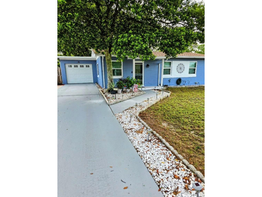 Introducing this delightful home packed with upgrades and - Beach Home for sale in Spring Hill, Florida on Beachhouse.com