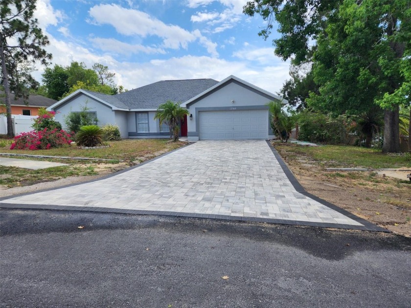 Discover this stunning 2006 home, featuring a brand-new paver - Beach Home for sale in Spring Hill, Florida on Beachhouse.com