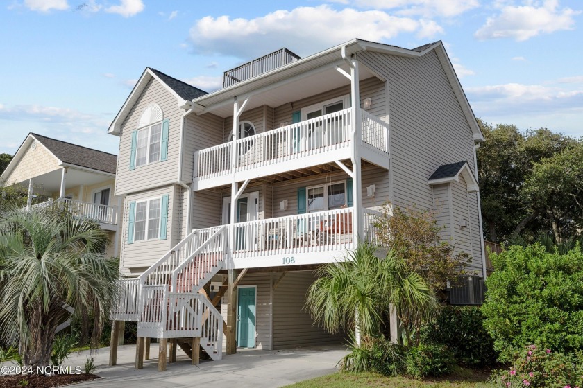 This Surf City coastal retreat features 4 bedrooms and 3 1/2 - Beach Home for sale in Surf City, North Carolina on Beachhouse.com