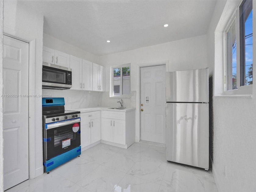 Step into this stunningly RENOVATED duplex nestled in North - Beach Townhome/Townhouse for sale in North Miami Beach, Florida on Beachhouse.com