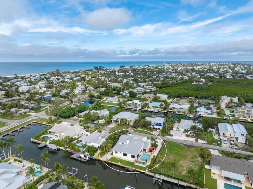 Discover paradise at this stunning canal front retreat that - Beach Home for sale in Holmes Beach, Florida on Beachhouse.com