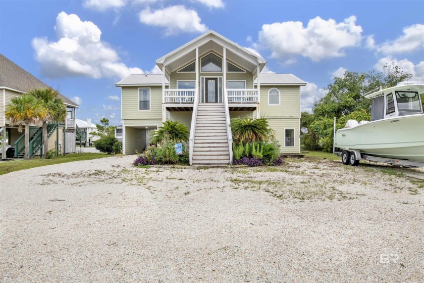 Located on the gated Ono Island, this property is situated on a - Beach Home for sale in Orange Beach, Alabama on Beachhouse.com