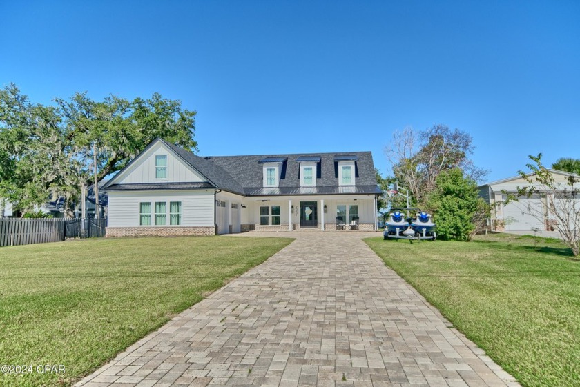 Discover the ultimate waterfront retreat in this stunning - Beach Home for sale in Lynn Haven, Florida on Beachhouse.com