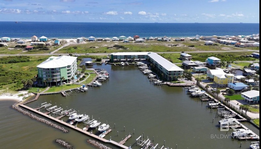 Fantastic bayfront condo with a deeded boat slip! Totally - Beach Home for sale in Gulf Shores, Alabama on Beachhouse.com