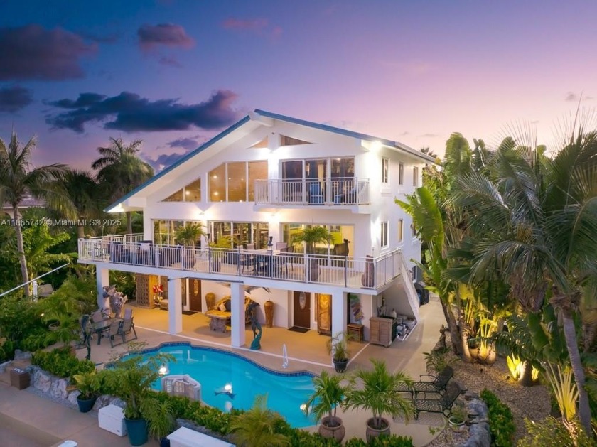 This wonderfully remodeled three story home in exclusive Coco - Beach Home for sale in Marathon, Florida on Beachhouse.com
