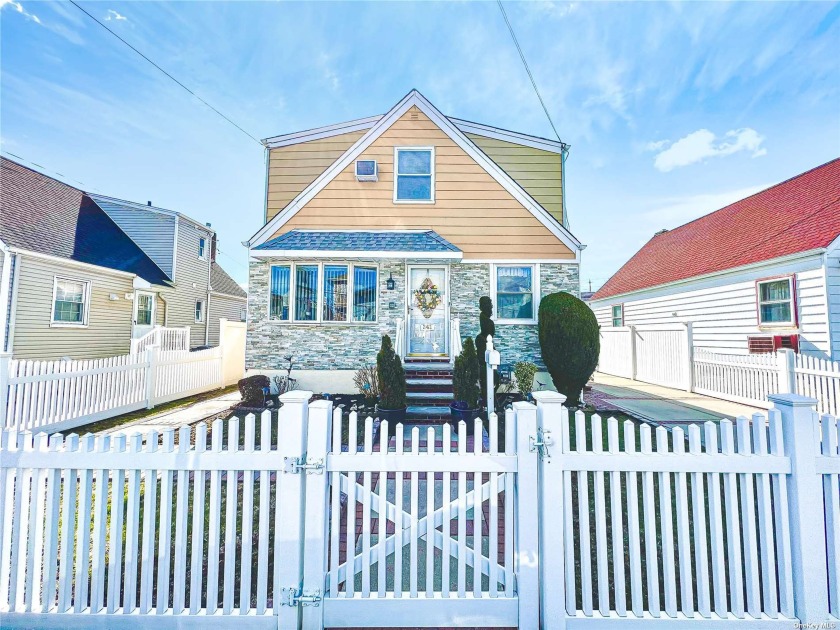 This detached waterfront cape sits within feet a way of Jamaica - Beach Home for sale in Rockaway Beach, New York on Beachhouse.com