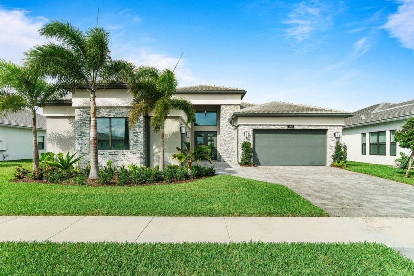 Stunning 4 BD 4 BA home on the lake in the prestigious Valencia - Beach Home for sale in Boynton Beach, Florida on Beachhouse.com