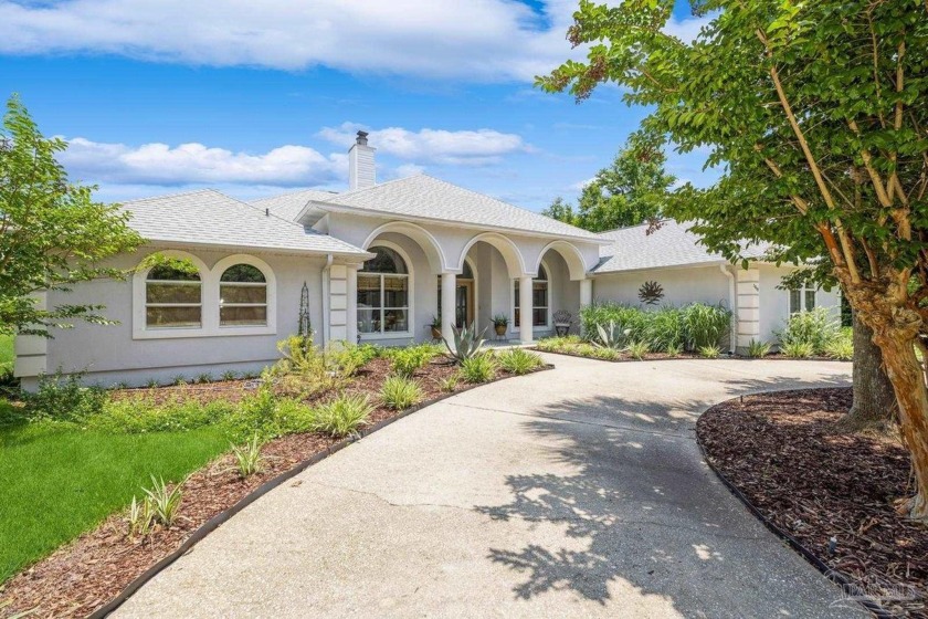 This beautiful home is your Florida oasis!  Situated on an - Beach Home for sale in Navarre, Florida on Beachhouse.com