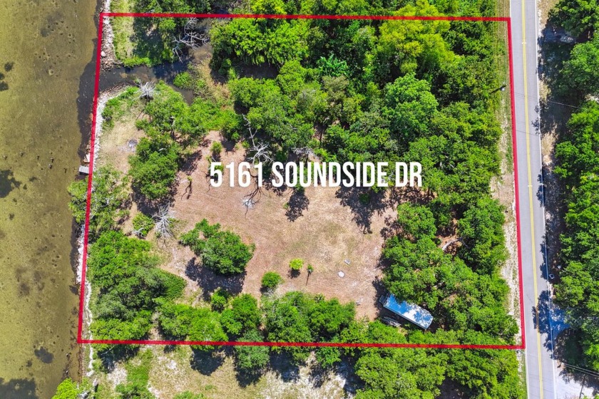 Don't miss this huge waterfront lot on Soundside Dr!  Sitting on - Beach Lot for sale in Gulf Breeze, Florida on Beachhouse.com