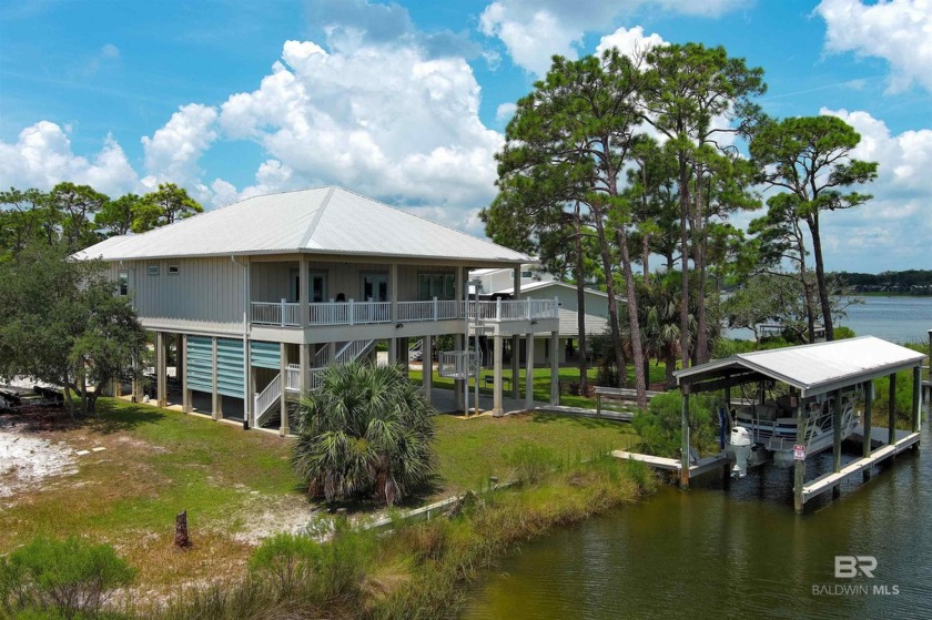 Stunning waterfront home on Ono Island situated at the end of a - Beach Home for sale in Orange Beach, Alabama on Beachhouse.com