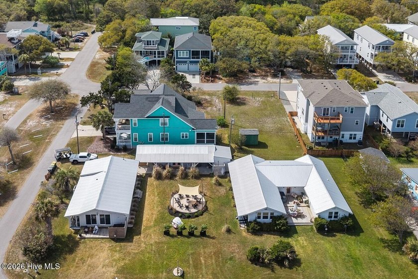 Why buy one beach house when you can buy three? Three bungalows - Beach Home for sale in Kure Beach, North Carolina on Beachhouse.com