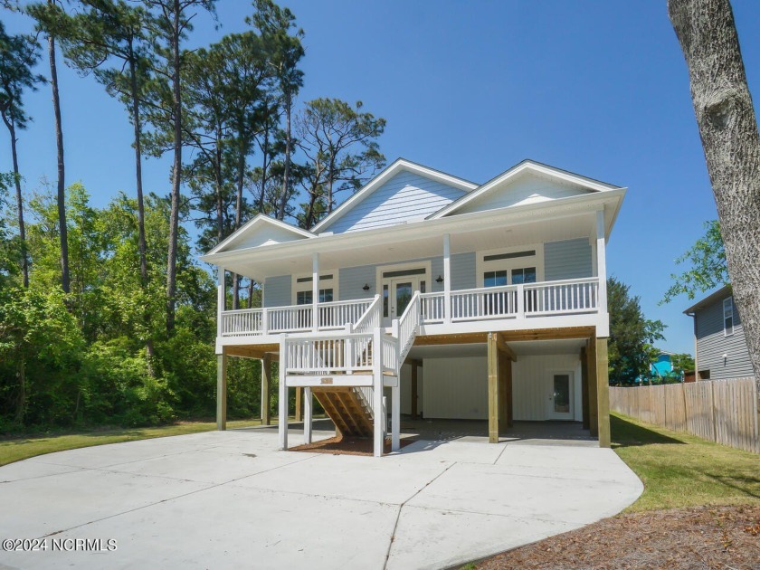 This brand new construction home features three bedrooms, two - Beach Home for sale in Oak Island, North Carolina on Beachhouse.com