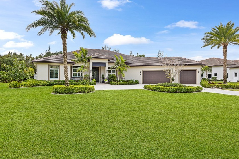 Tucked away on a quiet, one-acre preserve lot, this 2022-custom - Beach Home for sale in Palm Beach Gardens, Florida on Beachhouse.com