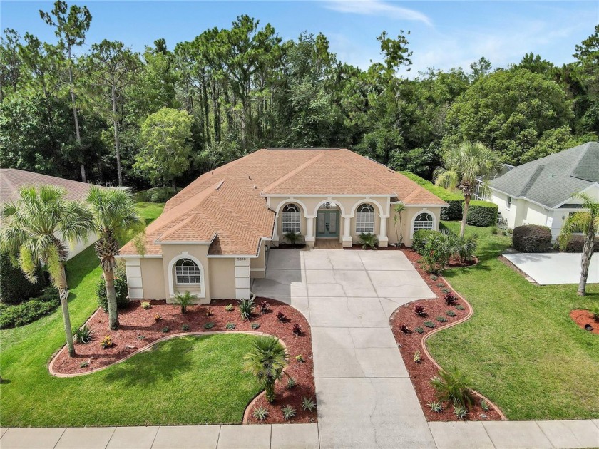 Discover luxurious living at 5348 Legend Hills Ln, nestled in - Beach Home for sale in Spring Hill, Florida on Beachhouse.com