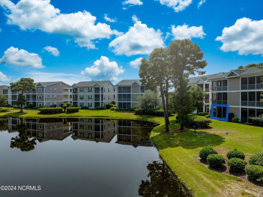 Enjoy the picturesque view of the Sandpiper Bay golf course and - Beach Condo for sale in Sunset Beach, North Carolina on Beachhouse.com