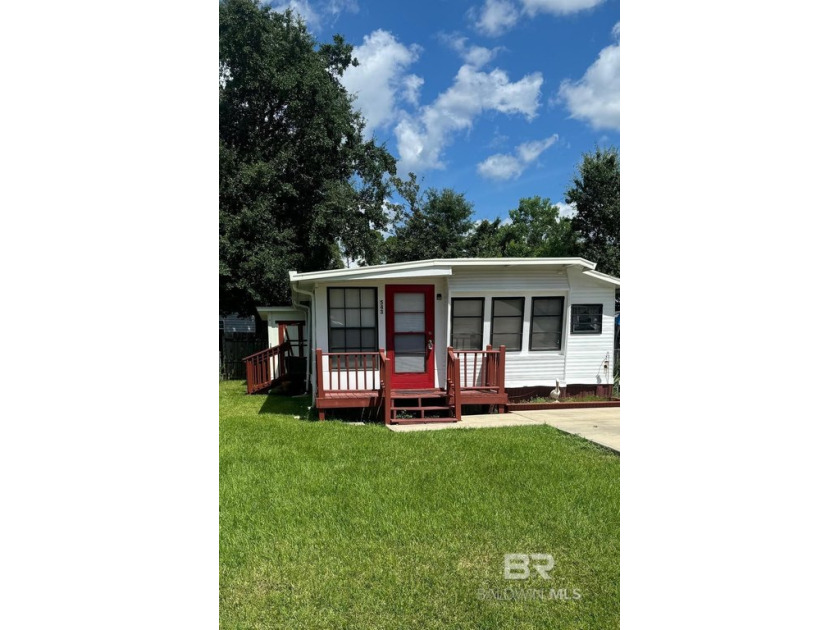 Welcome to your perfect coastal retreat! Step inside this quaint - Beach Home for sale in Lillian, Alabama on Beachhouse.com