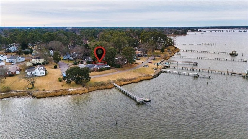 Step into this stunning 4-bedroom, 2.5-bathroom waterfront home - Beach Home for sale in Portsmouth, Virginia on Beachhouse.com