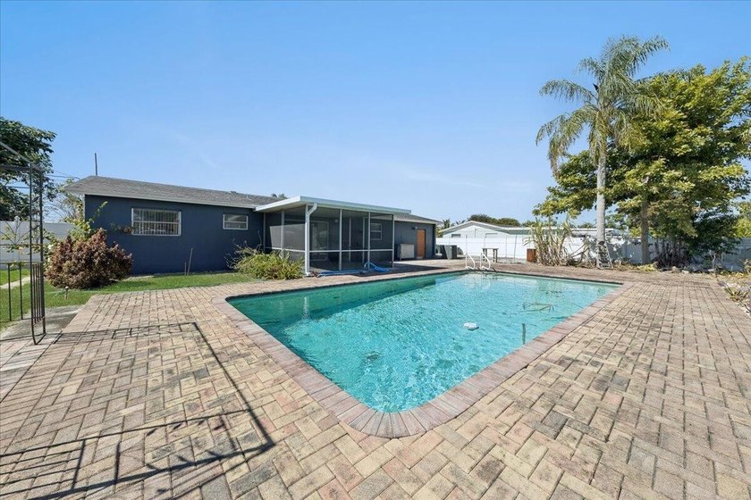 This 3 bedroom 2 barhroom 1 car garage house boasts a large pool - Beach Home for sale in West Palm Beach, Florida on Beachhouse.com