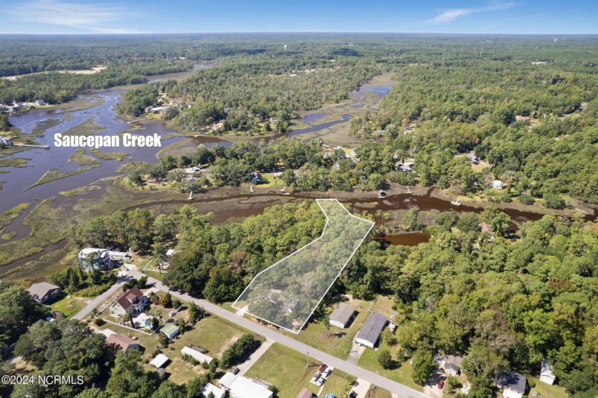 Over half an acre, bordering the Sasspan Creek! This inviting - Beach Home for sale in Shallotte, North Carolina on Beachhouse.com